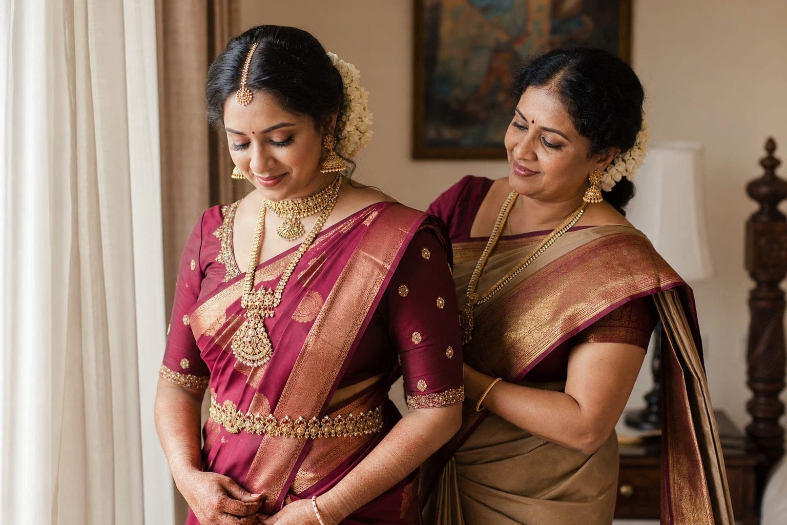 Indian mother helping bride with saree draping