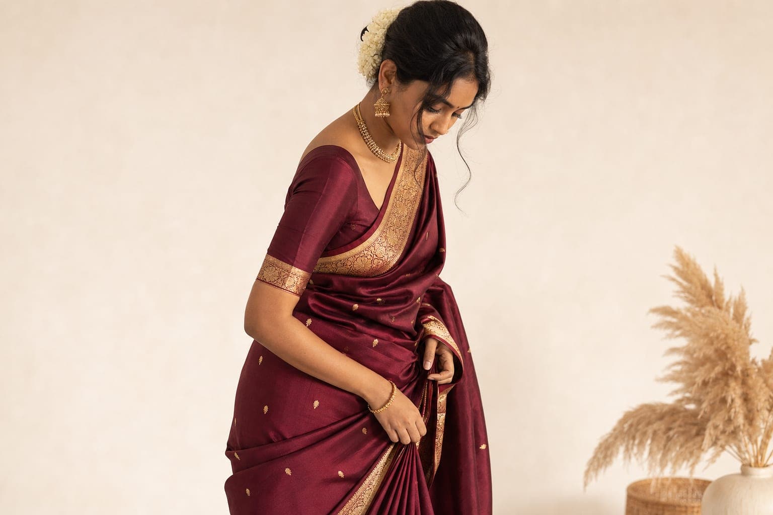 Indian woman in elegantly draped Kanjivaram saree